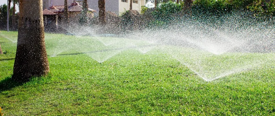 Many sprinklers watering a lawn in Delray Beach, FL.